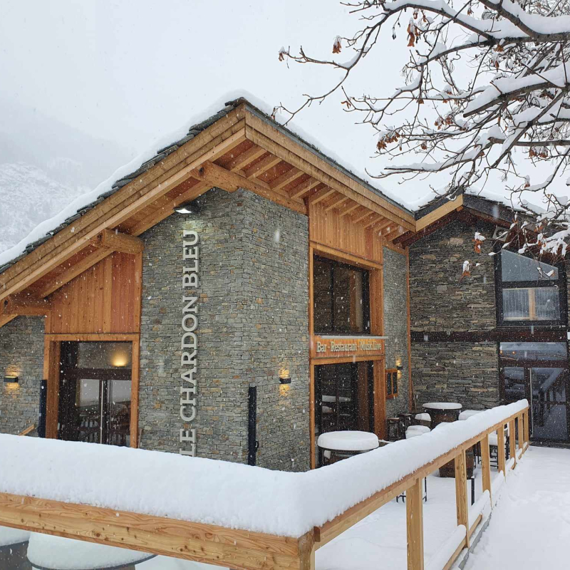 Snow-covered terrace of the Le Chardon Bleu restaurant in Val Cenis
