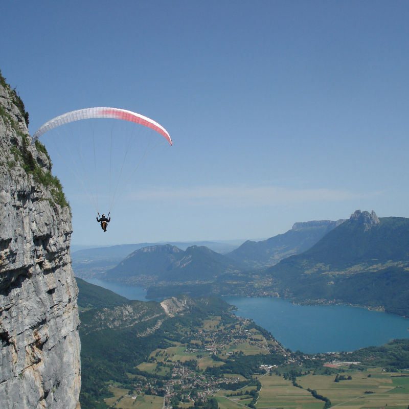 Paragliding flight above lake Annecy