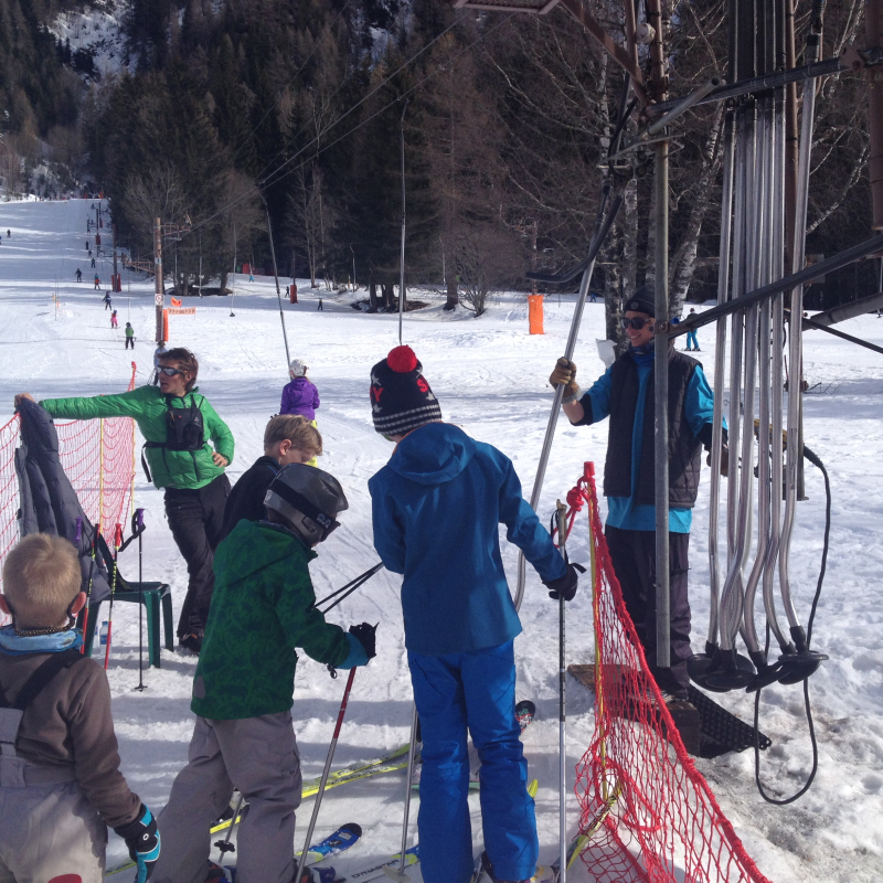 skiers taking the ski lift at Les Chosalets