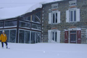 Maison sous la neige