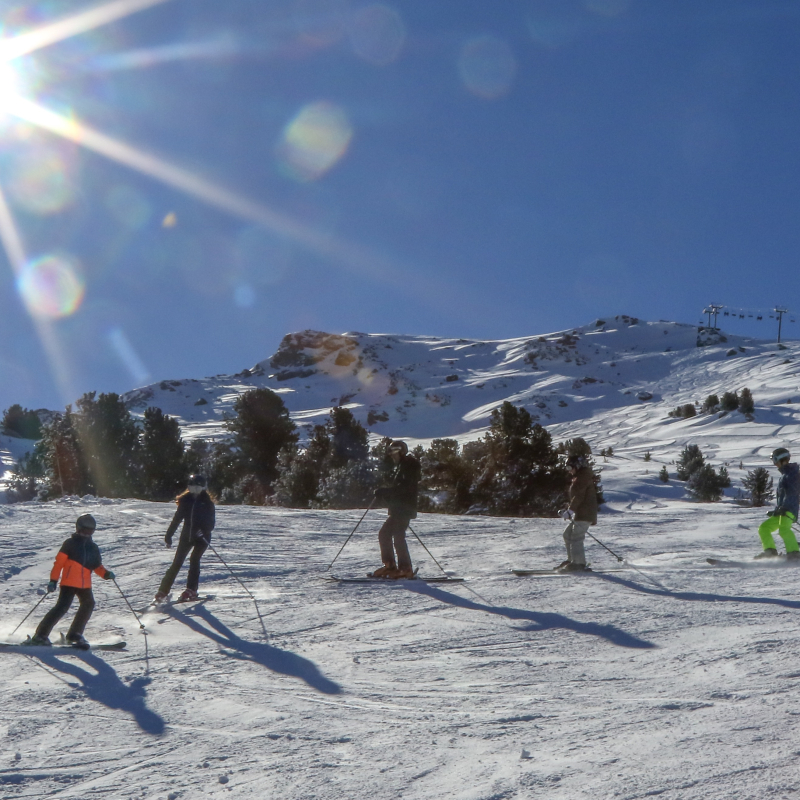 Skiers on the slopes of La Norma